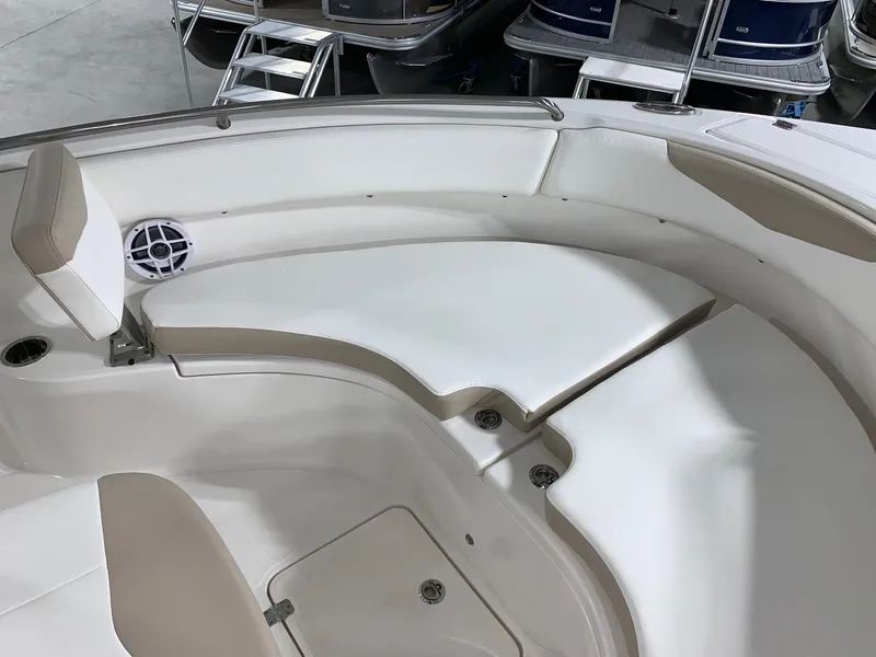 Slide: The Image of 2024 Robalo R222 Center Console boat interior seating area. - 16