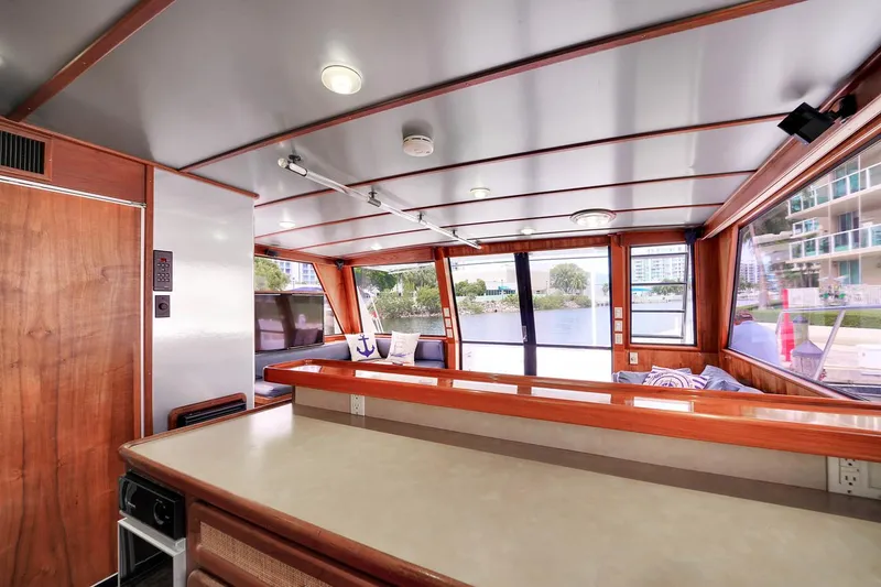 Slide: The Image of Interior of 1991 Jones-Goodell Yachtfish with panoramic windows and wooden finishes. - 15