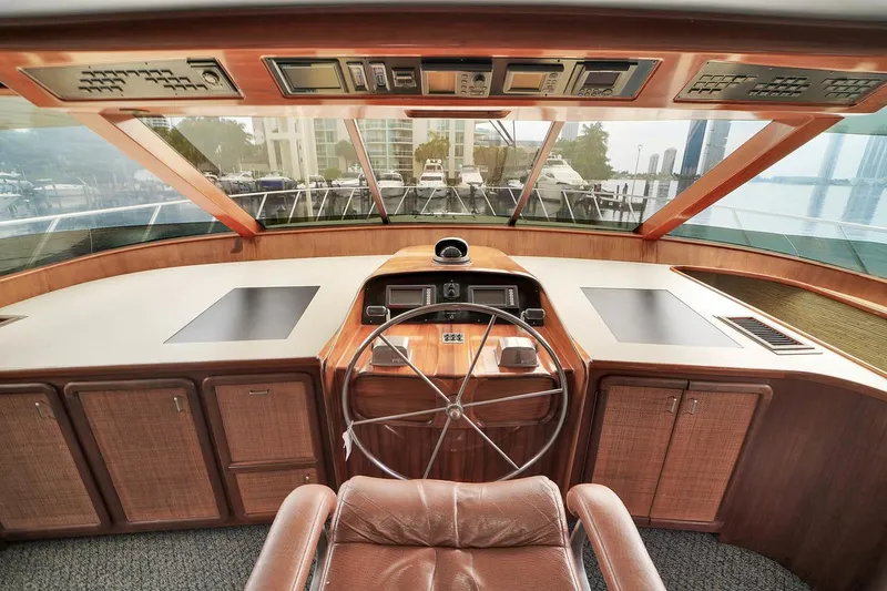 Slide: The Image of 1991 Jones-Goodell Yachtfish helm with panoramic view and classic wooden finish. - 2