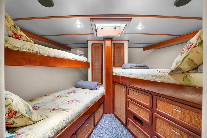Slide: The Image of Cozy cabin with bunk beds on a 1991 Jones-Goodell Yachtfish. - 25