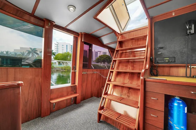 Slide: The Image of Interior of 1991 Jones-Goodell Yachtfish with wooden stairs and large windows. - 32