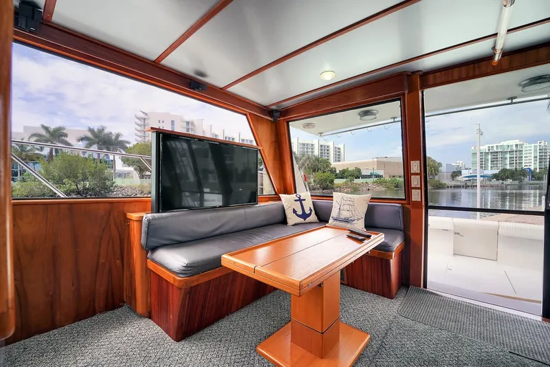 Slide: The Image of Interior of 1991 Jones-Goodell Yachtfish with seating area and waterfront view. - 35