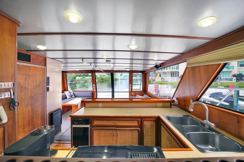 Slide: The Image of Interior of 1991 Jones-Goodell Yachtfish with modern kitchen and spacious seating area. - 39