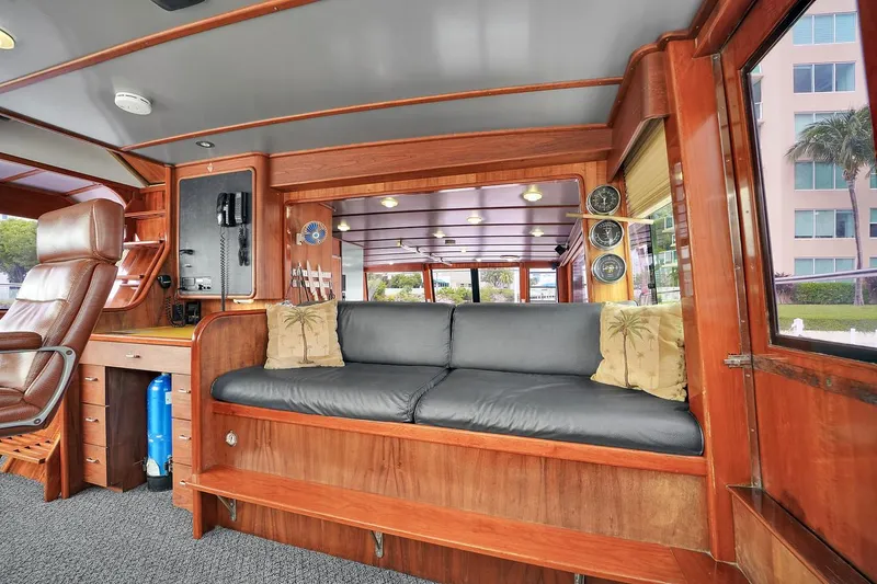 Slide: The Image of Interior of 1991 Jones-Goodell Yachtfish with wooden furnishings and cushioned seating. - 40