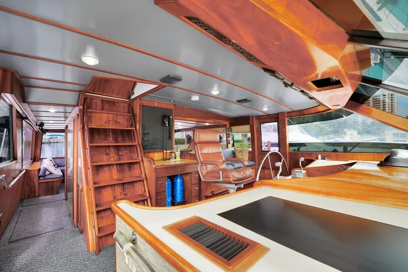 Slide: The Image of Luxurious interior of a 1991 Jones-Goodell Yachtfish with wooden finishes and modern amenities. - 41