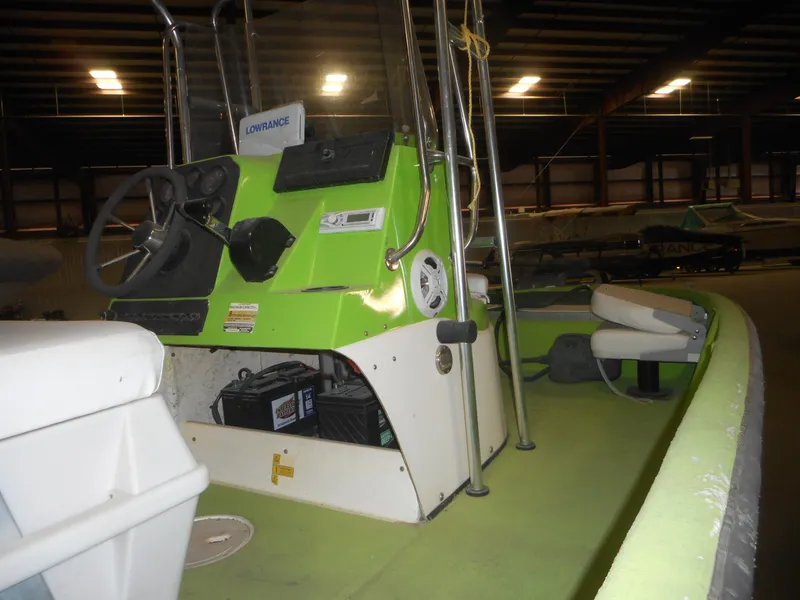 Slide: The Image of 1994 Hydra-Sports OSO Center Console boat interior with green dashboard and steering wheel. - 5