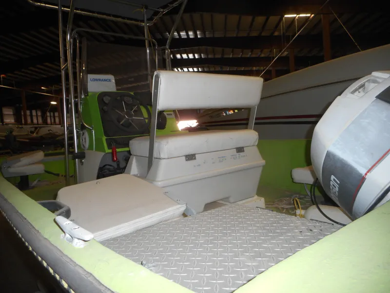 Slide: The Image of 1994 Hydra-Sports OSO Center Console boat interior with seating and control panel. - 9