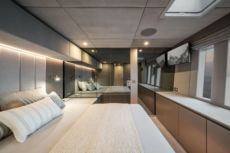 Slide: The Image of Luxurious Sunreef 80 yacht bedroom interior, 2025 model, featuring modern design and elegant lighting. - 41