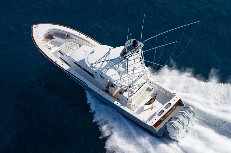 Slide: The Image of 2025 Valhalla Boatworks V-55 cruising on open water, showcasing sleek design and powerful engines. - 2