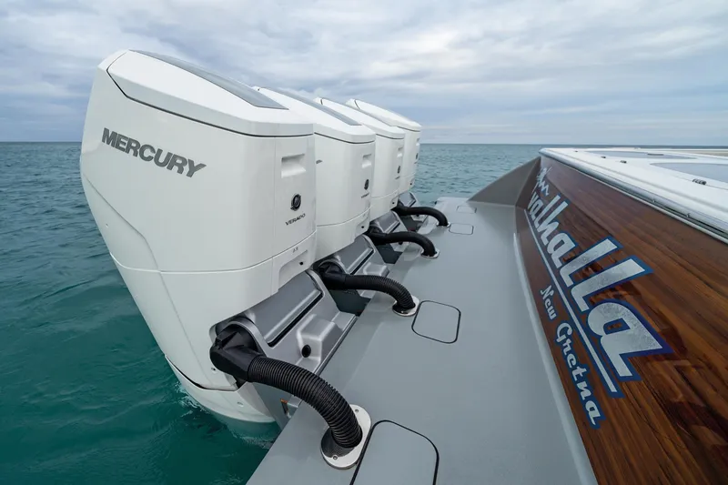 Slide: The Image of 2025 Valhalla Boatworks V-55 with Mercury outboard engines on open water. - 3