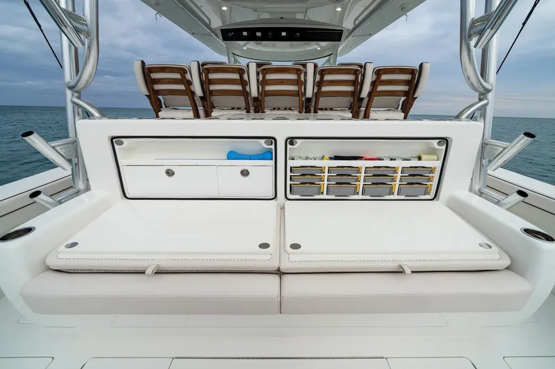 Slide: The Image of 2025 Valhalla Boatworks V-55 deck with seating and storage compartments. - 8