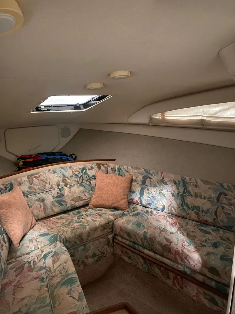 Slide: The Image of Interior of 1995 Bayliner Ciera boat with floral upholstery and skylight. - 13