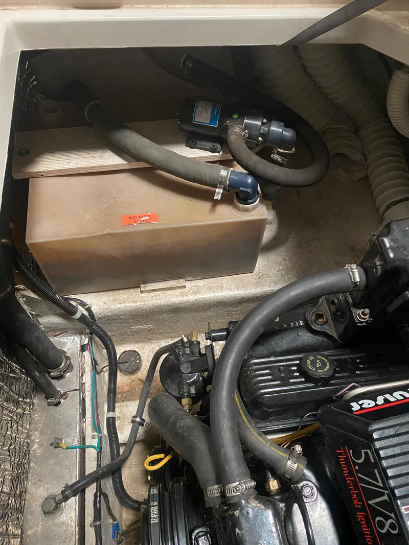 Slide: The Image of 1995 Bayliner Ciera engine compartment with visible components and wiring. - 15