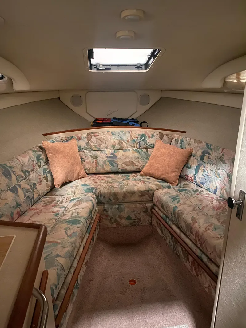 Slide: The Image of 1995 Bayliner Ciera cabin interior with floral upholstery and skylight. - 6
