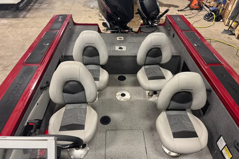 Slide: The Image of 2019 Tracker Targa 18 WT boat interior with four seats and red accents. - 19