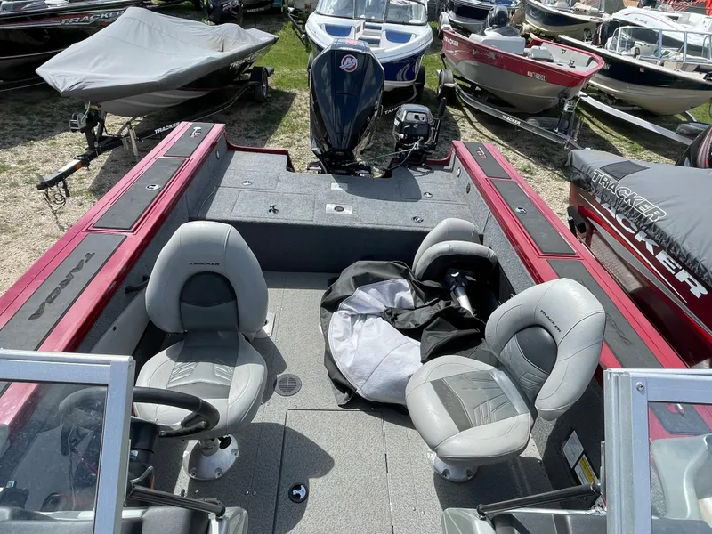 Slide: The Image of 2019 Tracker Targa 18 WT boat with Mercury 200 engine in a garage. - 4