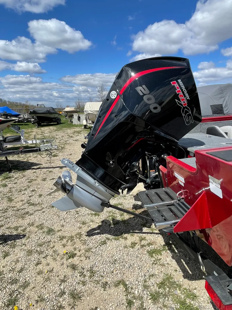 Slide: The Image of 2019 Tracker Targa 18 WT dashboard with steering wheel and Lowrance display. - 7
