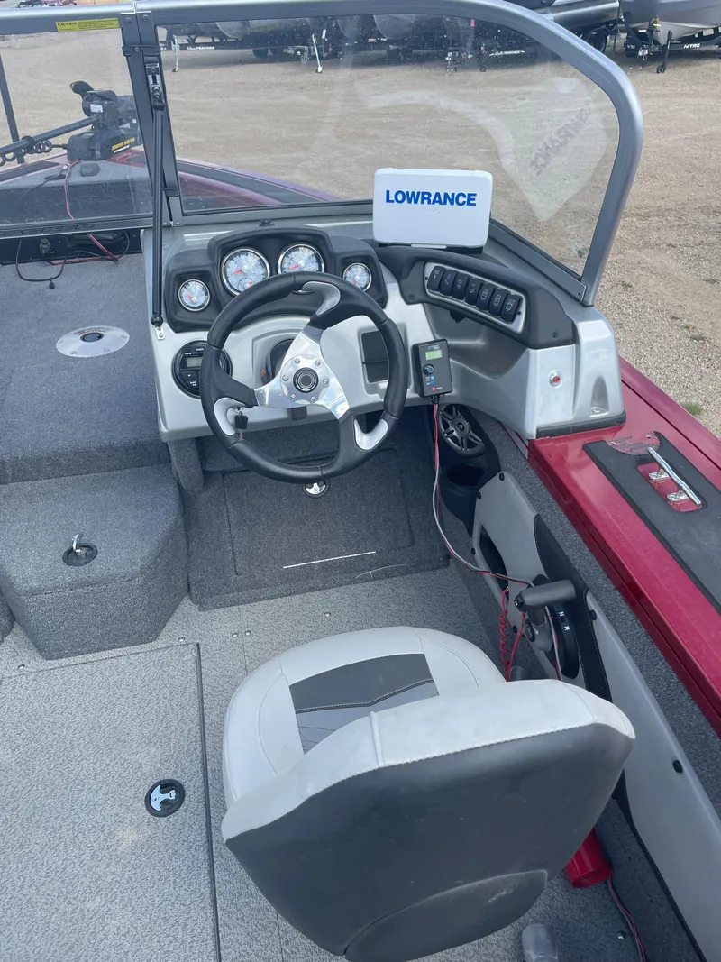 Slide: The Image of Dashboard of 2019 Tracker Targa 18 WT boat with Lowrance device and control switches. - 8