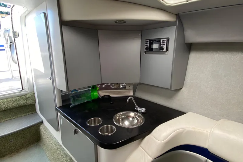 Slide: The Image of 2013 Formula 382 FASTech boat interior with kitchenette and seating area. - 14