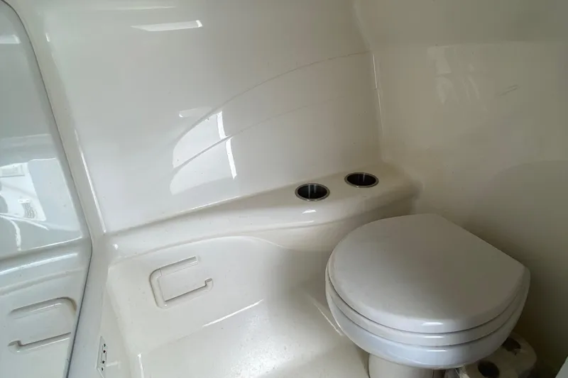 Slide: The Image of 2013 Formula 382 FASTech boat bathroom with toilet and cup holders. - 18