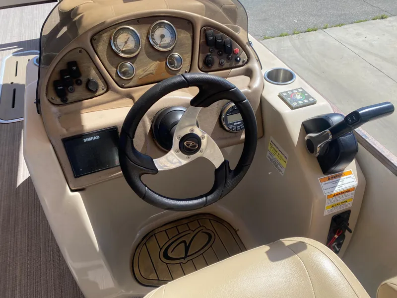 Slide: The Image of 2019 Veranda VF25F2 boat interior with open storage compartment and beige seating. - 15