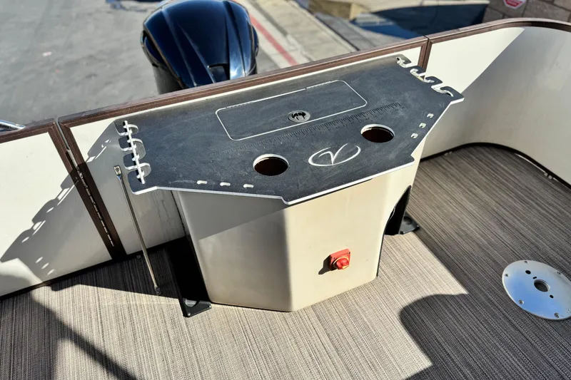 Slide: The Image of 2019 Veranda VF25F2 boat deck with utility panel and motor in sunlight. - 22