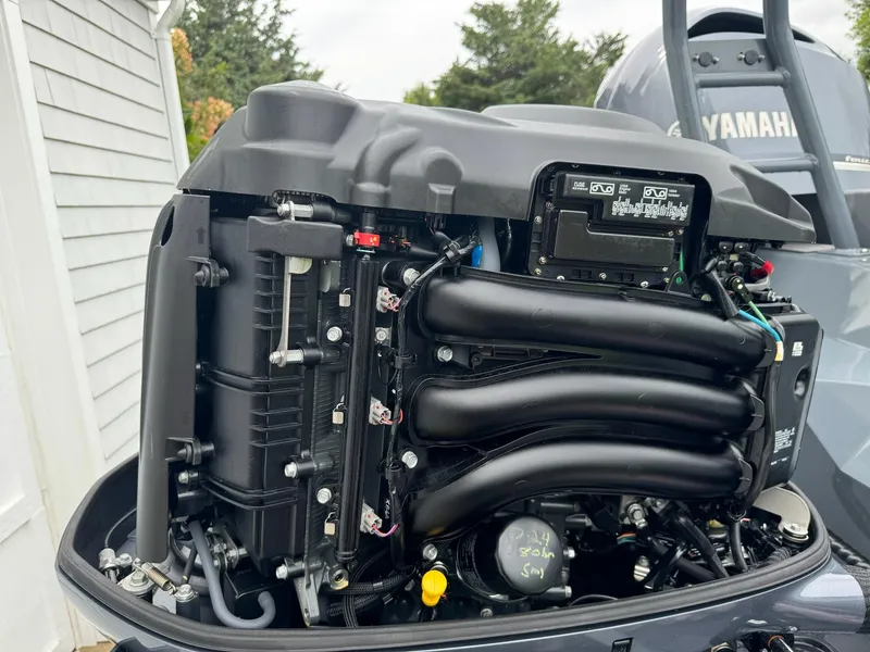 Slide: The Image of Close-up of a 2019 Sealegs 9M Yamaha outboard engine, showcasing intricate components. - 15
