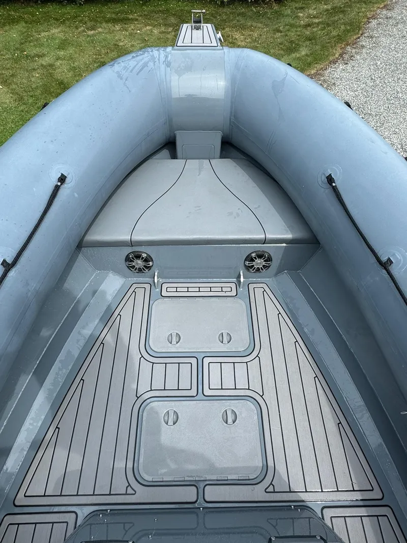 Slide: The Image of 2019 Sealegs 9M boat interior with gray deck and seating area. - 20