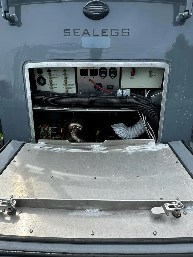 Slide: The Image of Sealegs 9M 2019 boat engine compartment with control panel and wiring. - 21