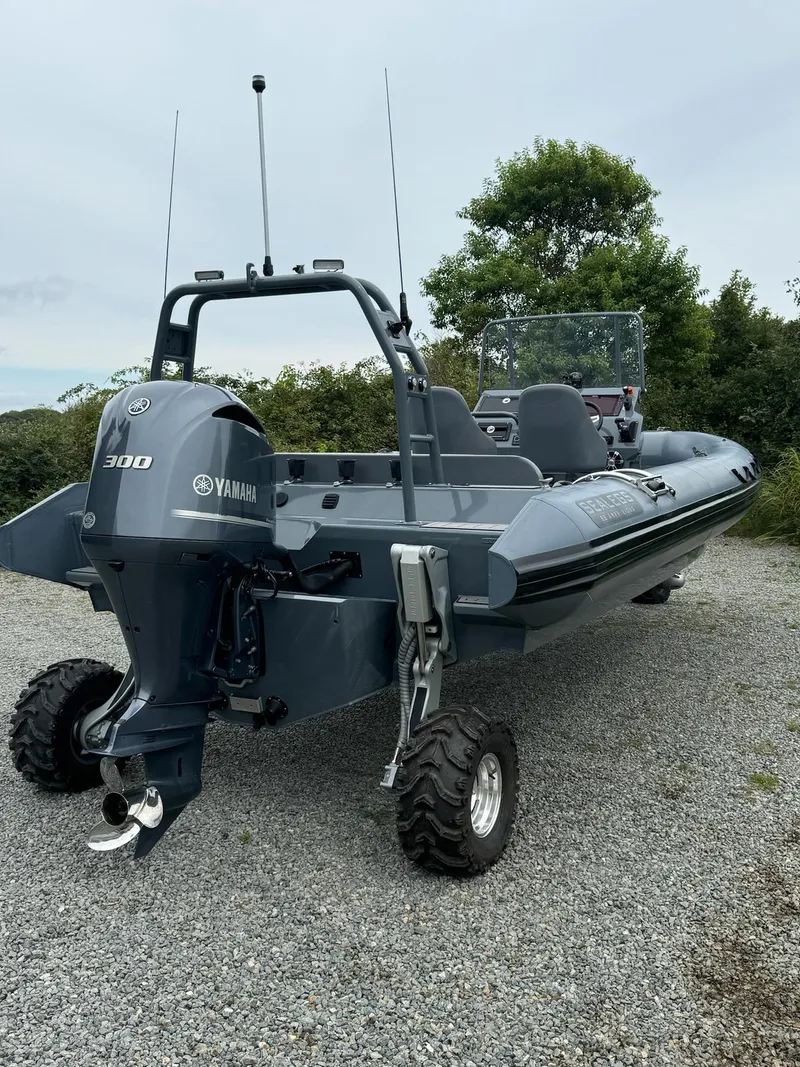 Slide: The Image of 2019 Sealegs 9M amphibious boat with Yamaha 300 engine on gravel. - 7
