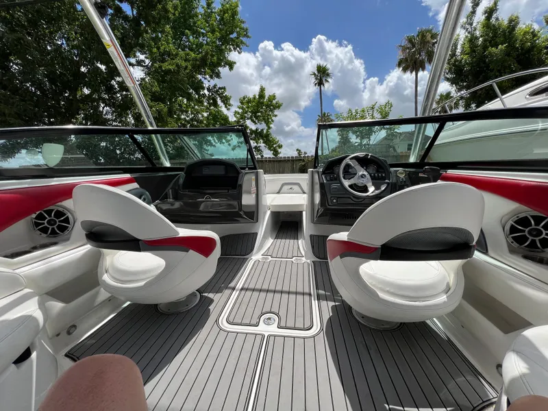 Slide: The Image of Interior of a 2015 Monterey 224FSX boat with white and red seating. - 20