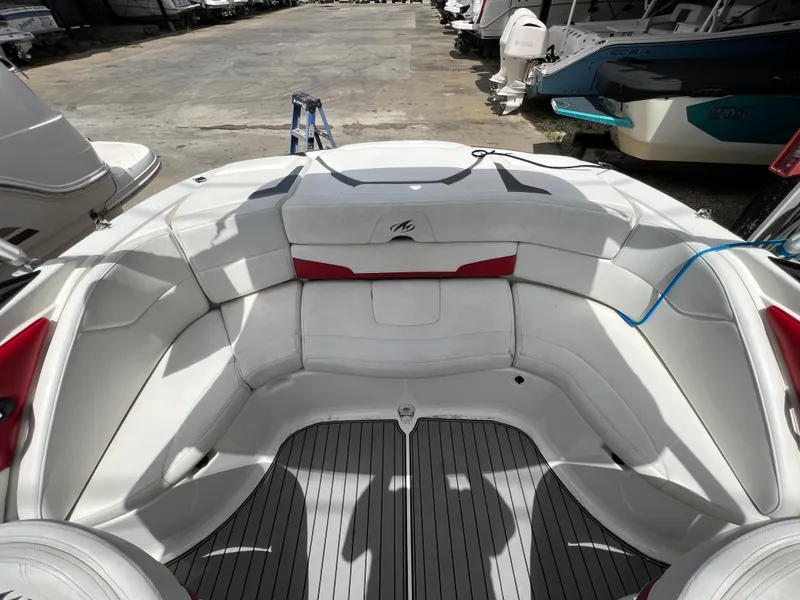 Slide: The Image of 2015 Monterey 224FSX boat interior with white and red seating. - 22