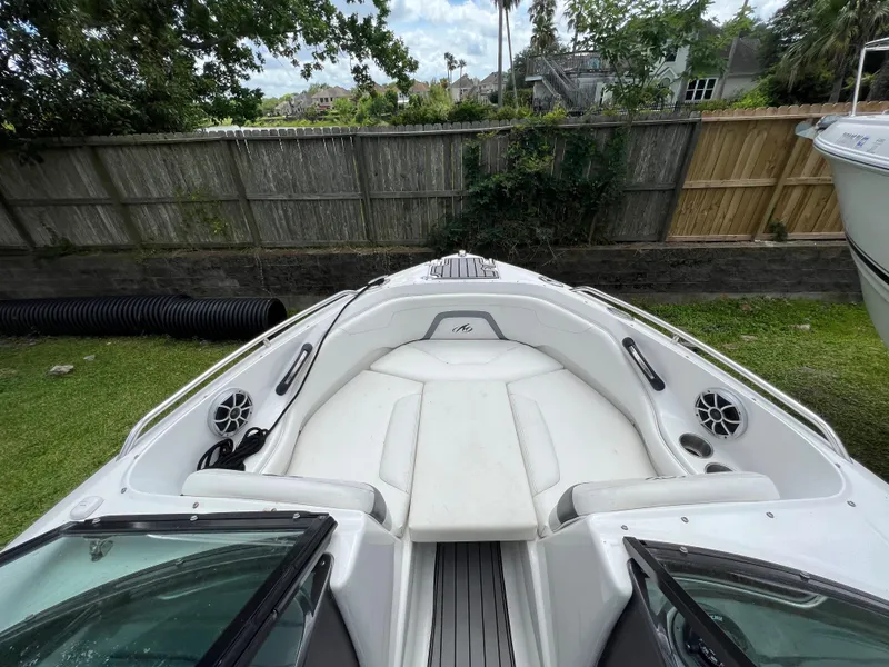 Slide: The Image of 2015 Monterey 224FSX boat with white interior and bow seating. - 23