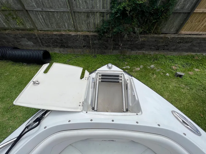 Slide: The Image of 2015 Monterey 224FSX boat bow with open storage compartment. - 24