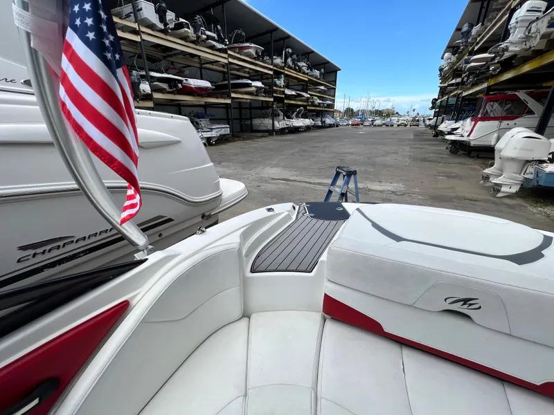 Slide: The Image of 2015 Monterey 224FSX boat in marina storage with American flag. - 27