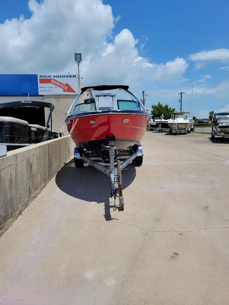 Slide: The Image of 2015 Monterey 224FSX boat in red, parked at Ron Hoover service center. - 3