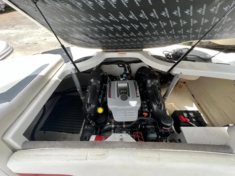 Slide: The Image of 2015 Monterey 224FSX boat engine compartment with open hatch. - 30