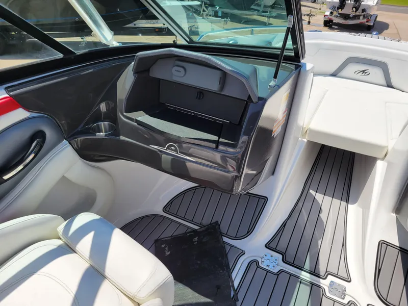 Slide: The Image of 2015 Monterey 224FSX boat interior with seating and storage compartments. - 34