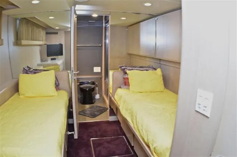 Slide: The Image of Twin cabin with yellow bedding in 1990 Broward Raised Pilothouse MY yacht. - 28