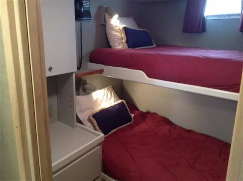 Slide: The Image of Bunk beds in 1990 Broward Raised Pilothouse MY yacht cabin with red bedding. - 29