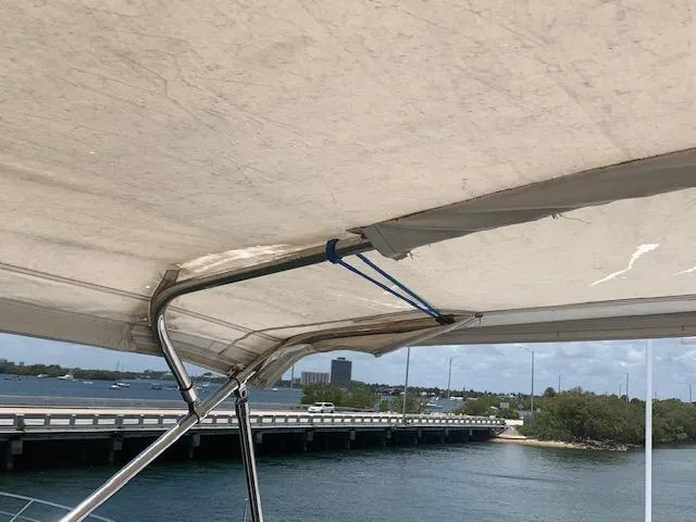Slide: The Image of Broward Raised Pilothouse MY 1990 yacht canopy with ocean and bridge view. - 30