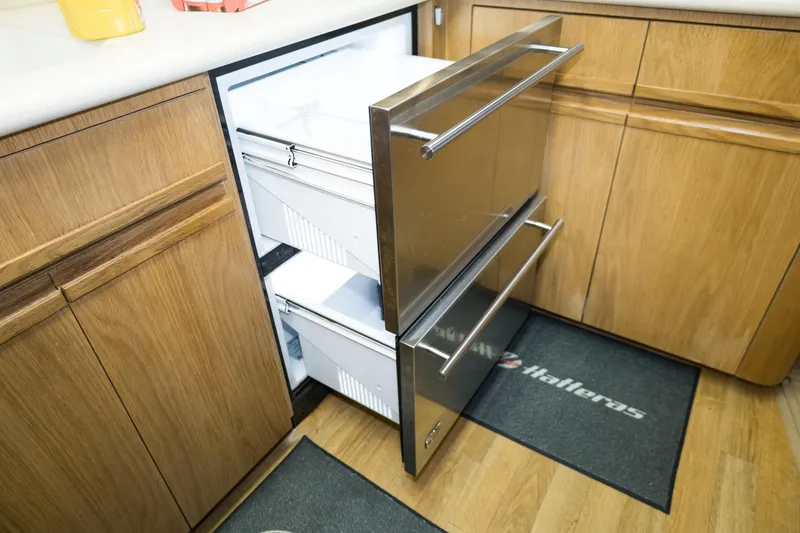 Slide: The Image of Stainless steel drawer refrigerator in a 1997 Hatteras 65 Convertible yacht kitchen. - 11