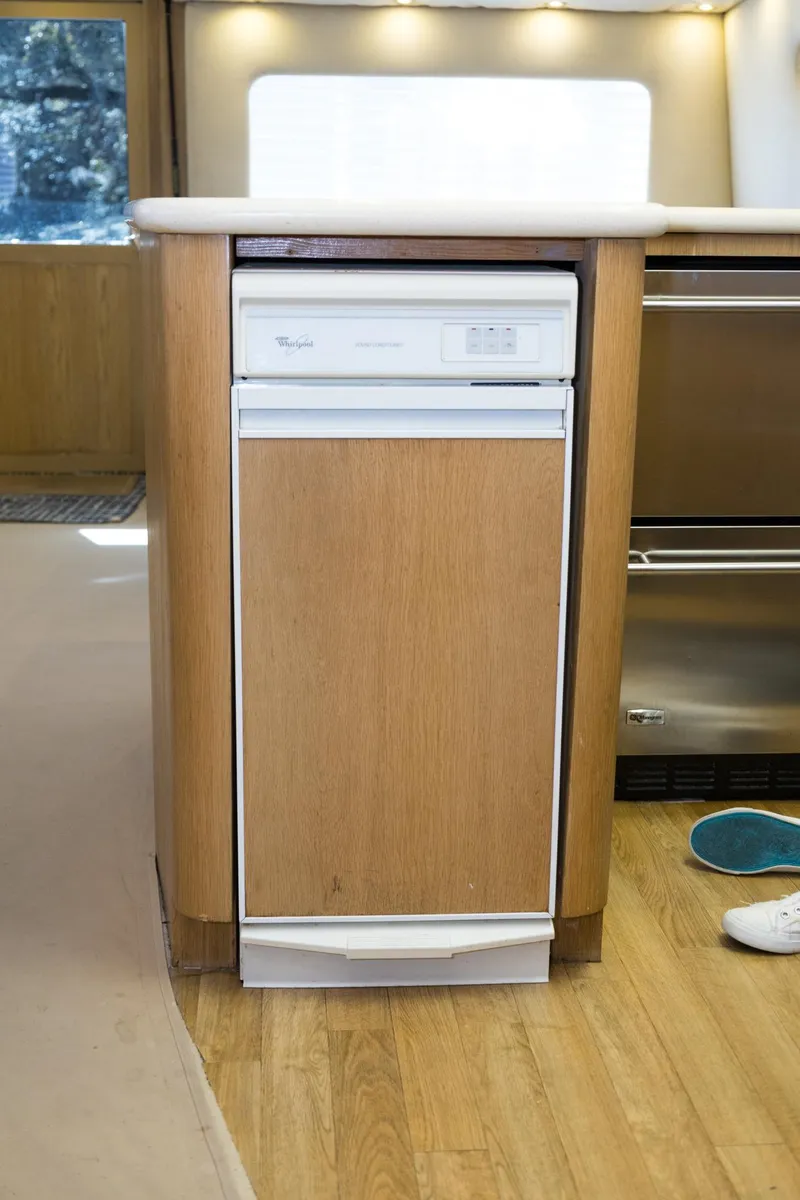 Slide: The Image of Compact dishwasher in 1997 Hatteras 65 Convertible yacht kitchen interior. - 12