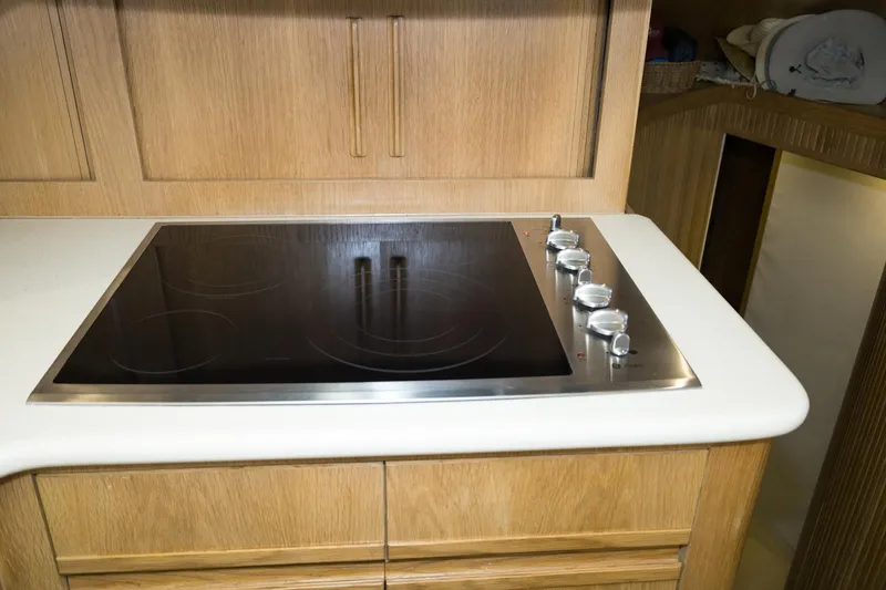 Slide: The Image of Modern kitchen stove in 1997 Hatteras 65 Convertible yacht interior. - 13