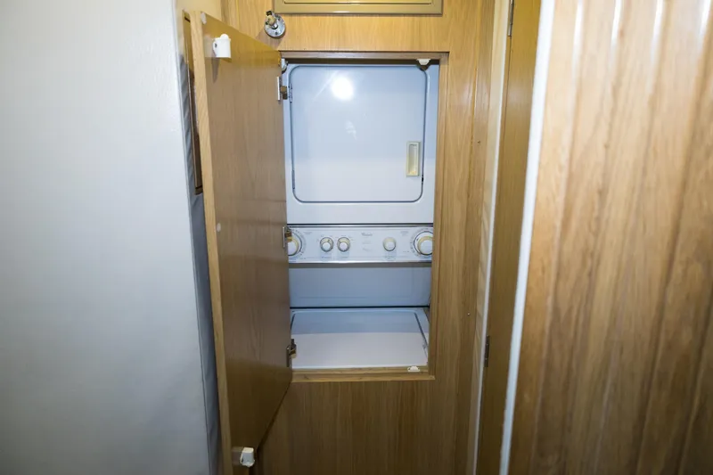 Slide: The Image of 1997 Hatteras 65 Convertible yacht interior with built-in laundry unit. - 20