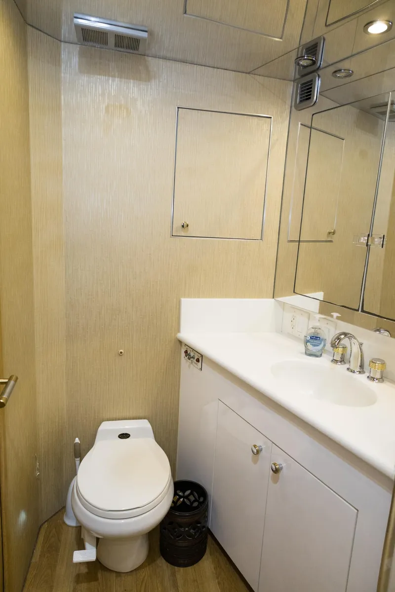 Slide: The Image of Bathroom interior of 1997 Hatteras 65 Convertible yacht, featuring modern fixtures. - 24