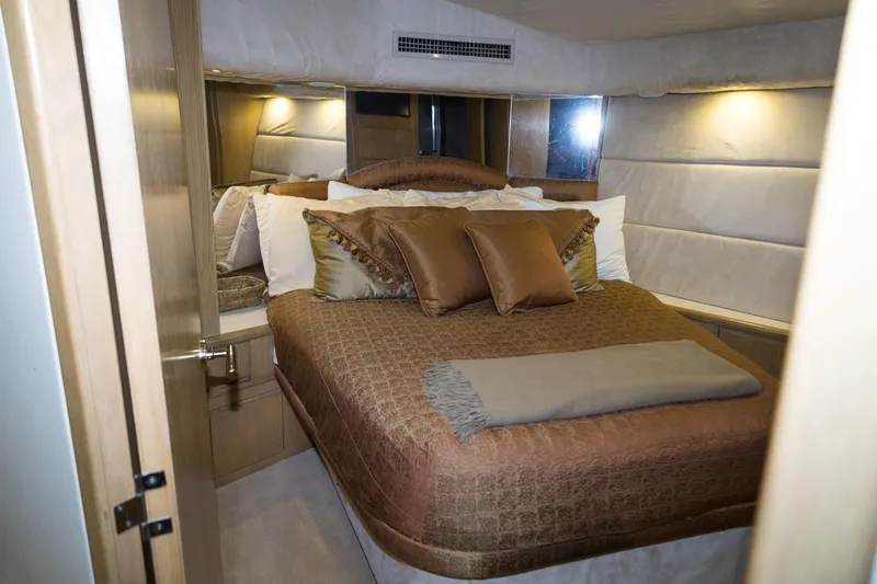 Slide: The Image of Luxurious bedroom interior of 1997 Hatteras 65 Convertible yacht with elegant bedding. - 27