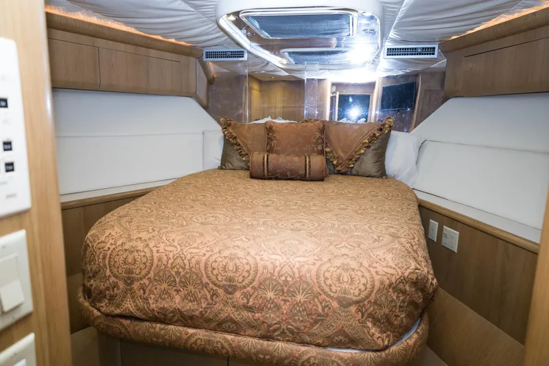 Slide: The Image of Luxurious bedroom interior of 1997 Hatteras 65 Convertible yacht with elegant bedding. - 33