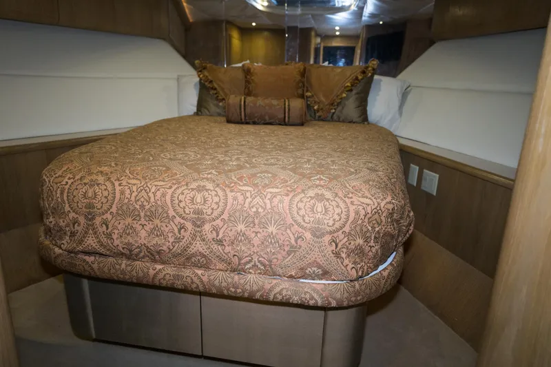 Slide: The Image of Luxurious bedroom interior of 1997 Hatteras 65 Convertible yacht with elegant bedding. - 34