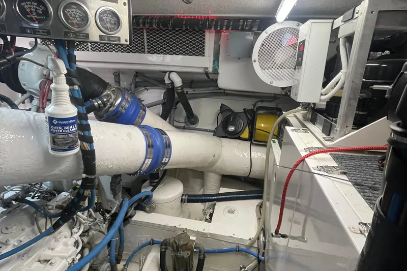 Slide: The Image of Engine room of 1997 Hatteras 65 Convertible yacht with gauges and pipes. - 46